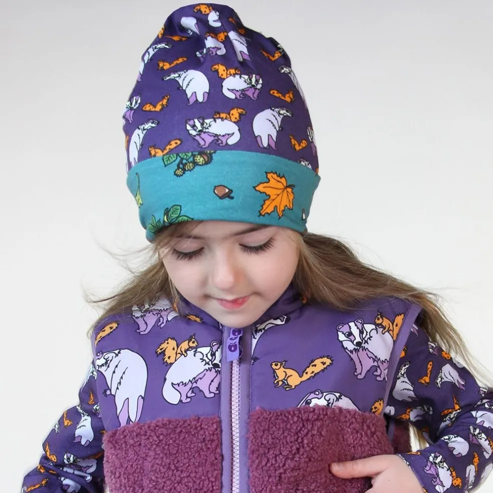 Reversible beanie with badger, fox and Fall leaves Loganberry